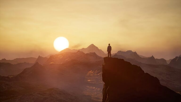 Adventure Man looking at Rocky Mountain Landscape