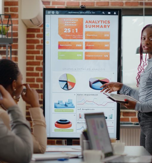 African american people receiving applause from colleagues at business meeting